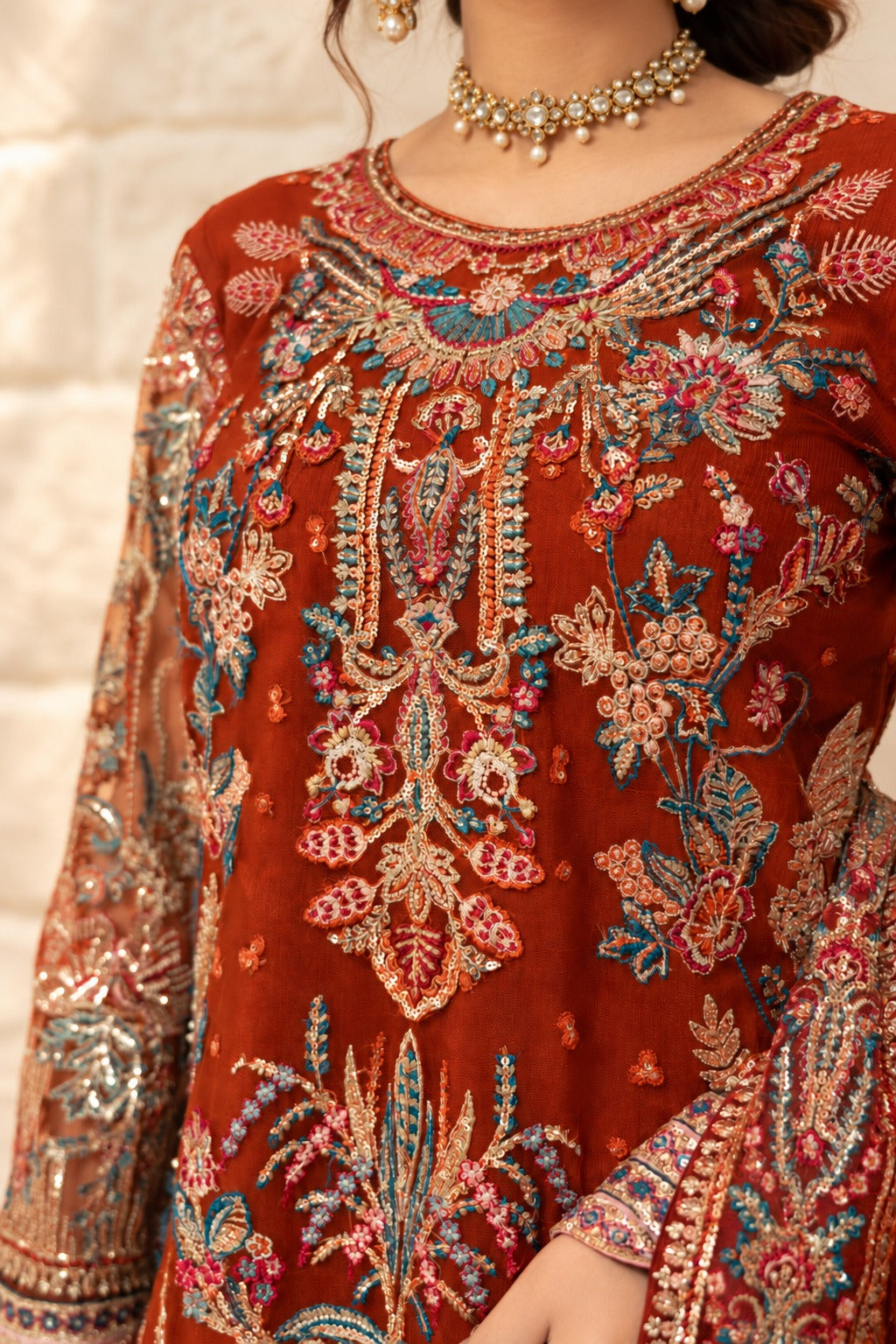 Saffron Royale neckline embroidery close up in teal, coral and gold